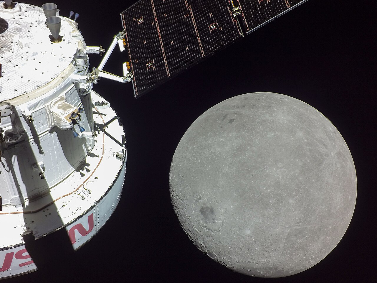 Orion spacecraft with the Moon in the background during Artemis I flyby